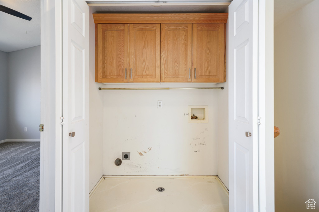 Laundry area with carpet, electric dryer hookup, washer hookup, and cabinet space