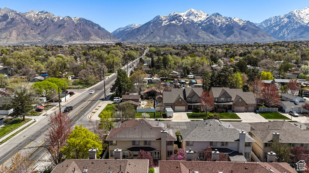 Property view of mountains with a residential view