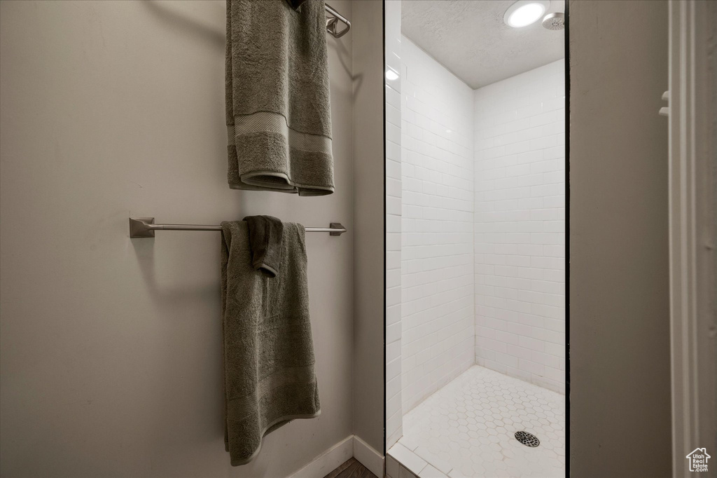 Bathroom featuring a shower stall