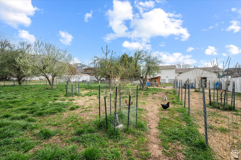 View of yard featuring fence