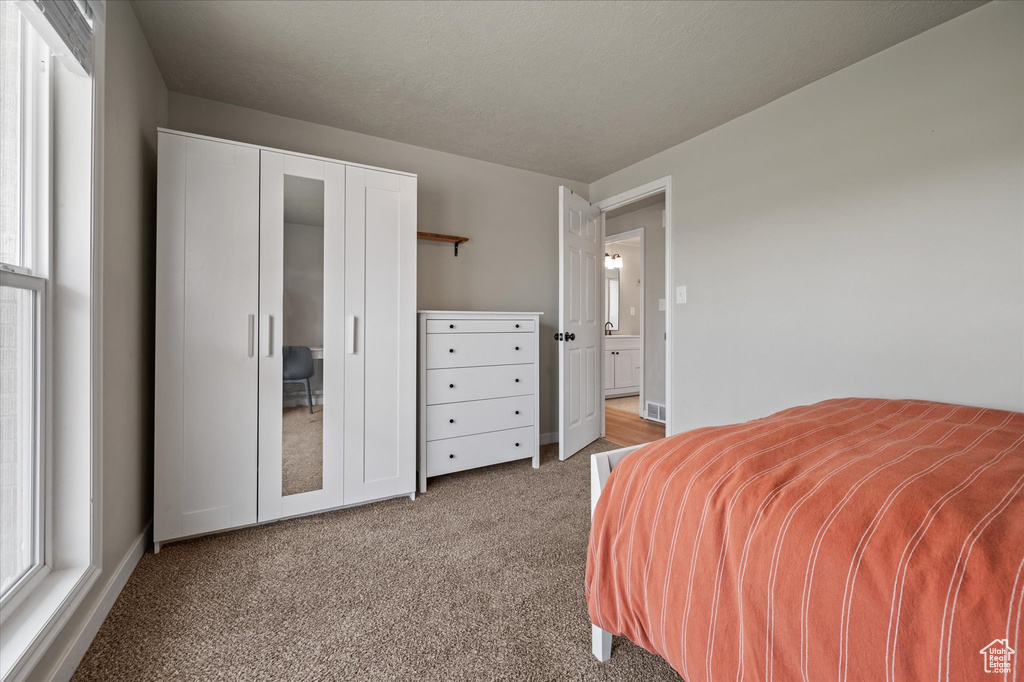 Bedroom featuring carpet flooring