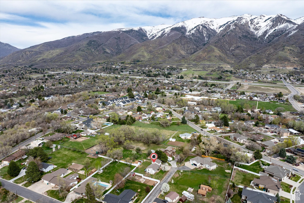Drone / aerial view with a residential view and a mountain view