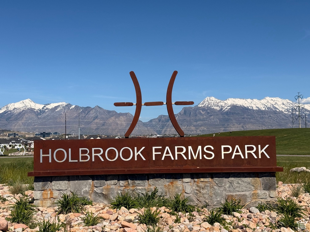 Community sign with a mountain view