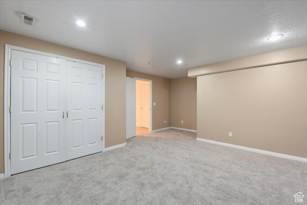 Unfurnished bedroom featuring recessed lighting, carpet flooring, visible vents, and baseboards
