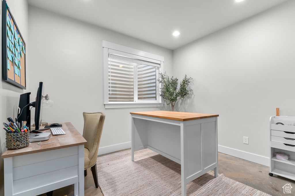 Office space with baseboards and recessed lighting