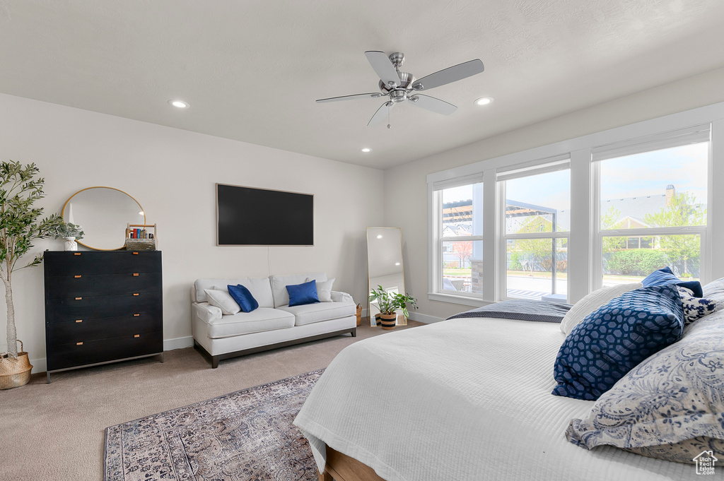 Bedroom featuring ceiling fan, light colored carpet, baseboards, and recessed lighting
