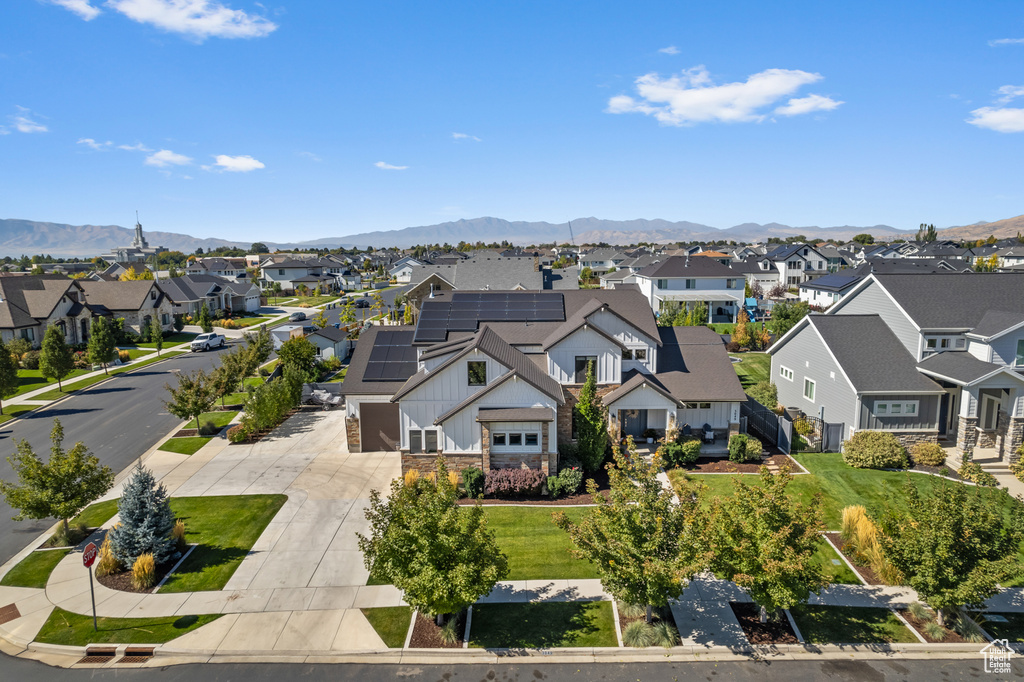 Drone / aerial view featuring a mountain view and a residential view