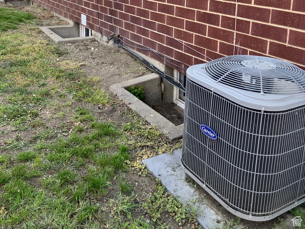 Exterior details with brick siding and cooling unit