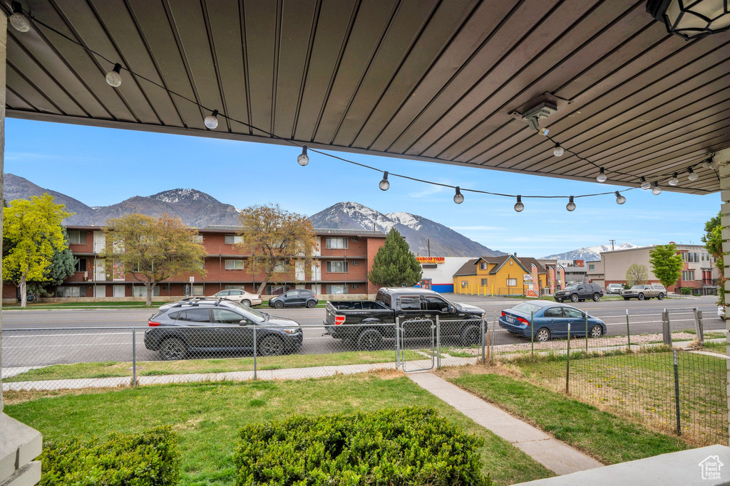 Exterior space featuring fence, a mountain view, and a residential view