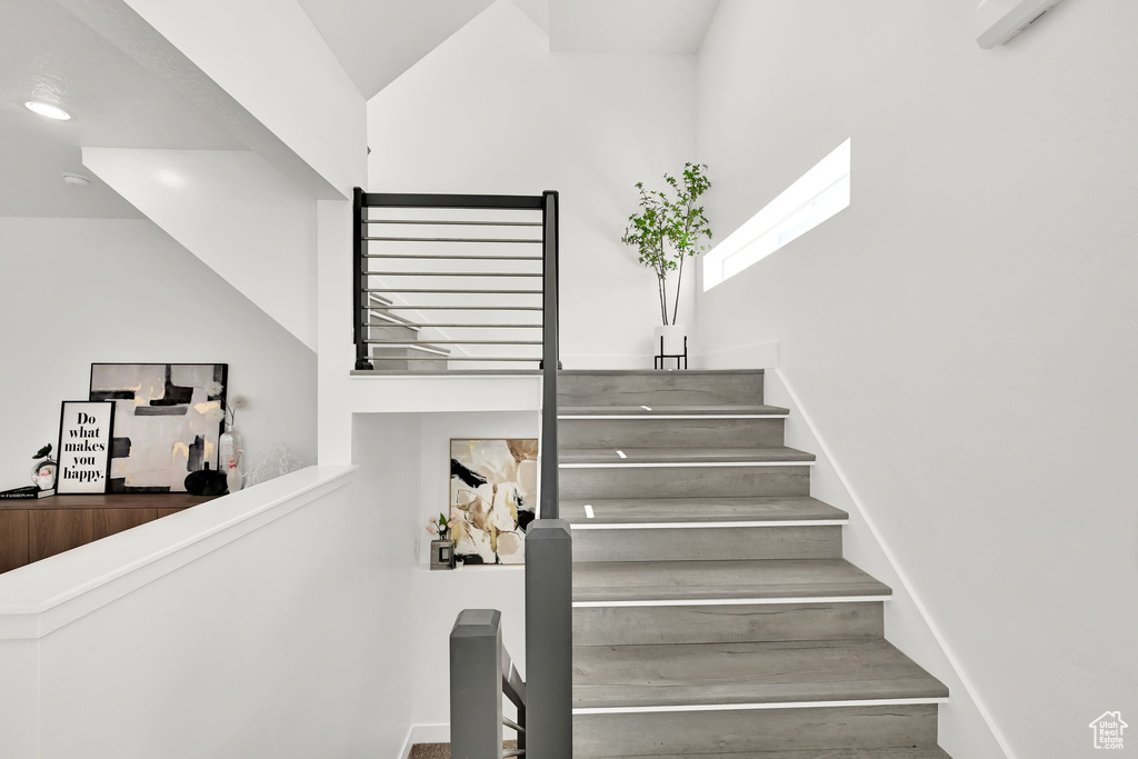 Stairway featuring recessed lighting