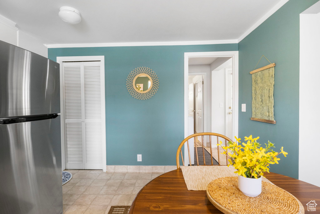 Dining area featuring baseboards and ornamental molding