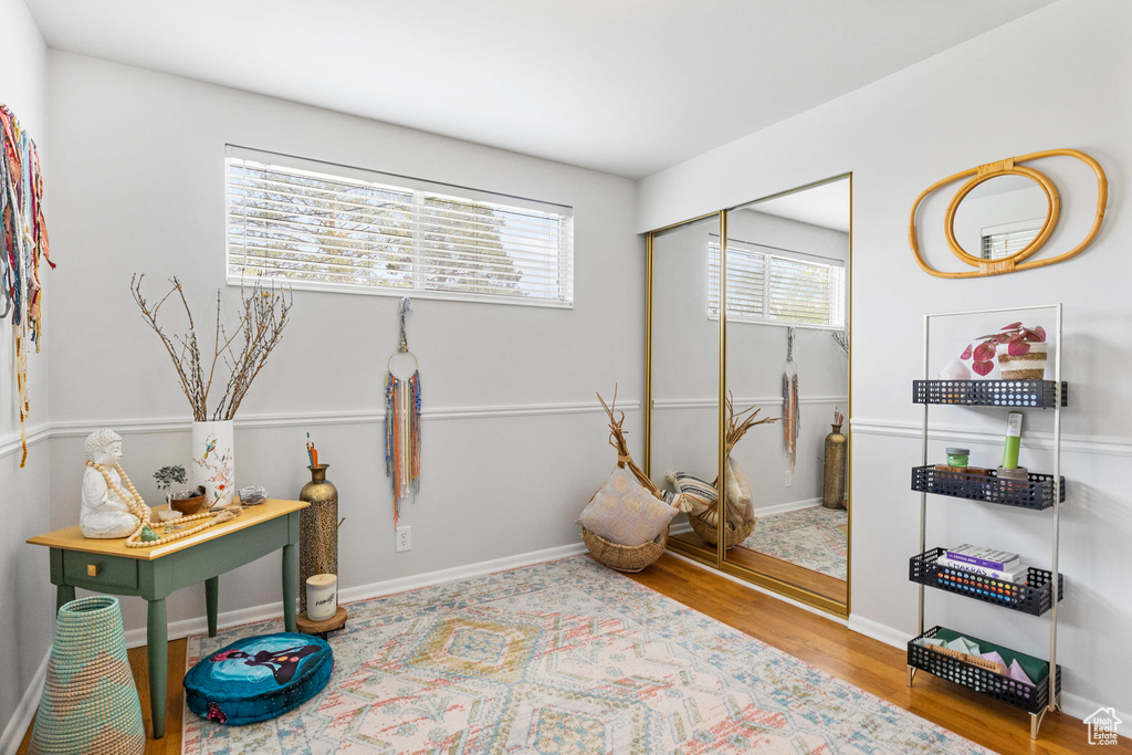 Interior space featuring baseboards and wood finished floors