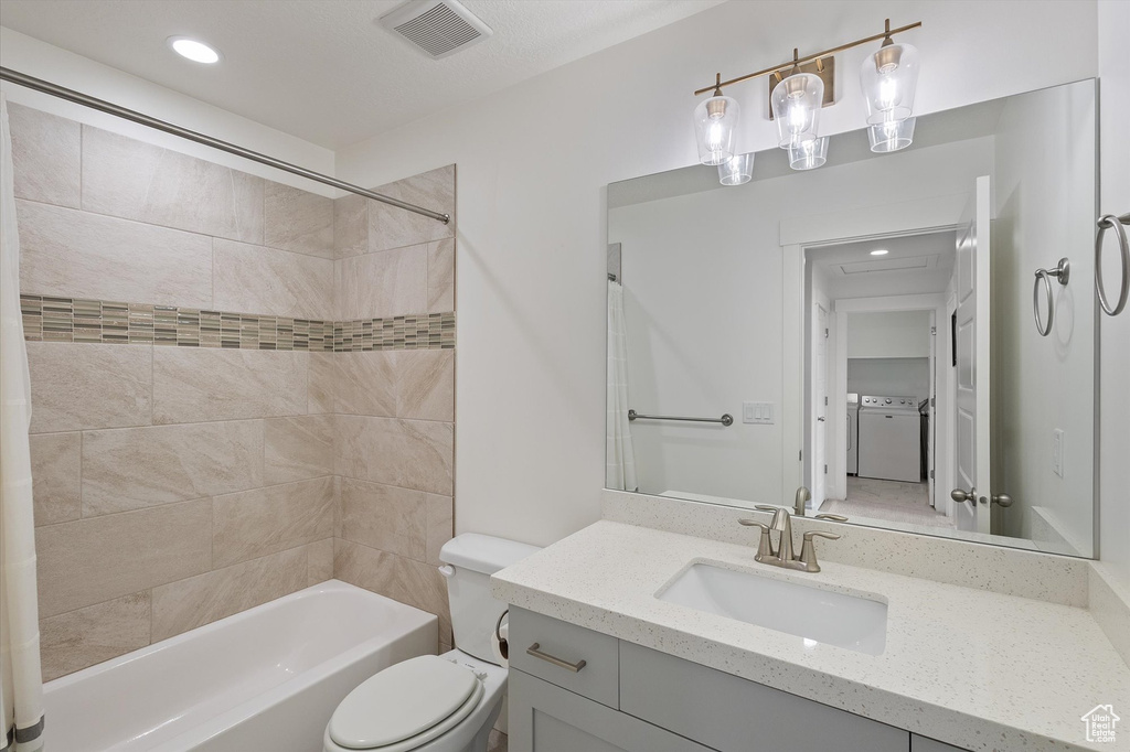 Bathroom featuring bathing tub / shower combination, vanity, toilet, visible vents, and recessed lighting