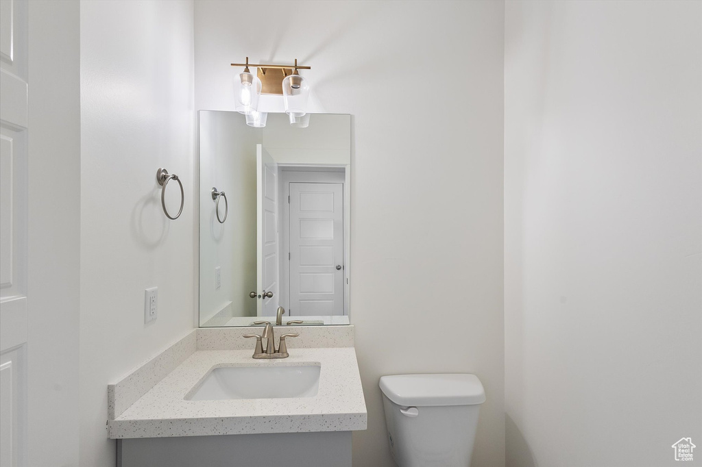 Bathroom featuring vanity and toilet