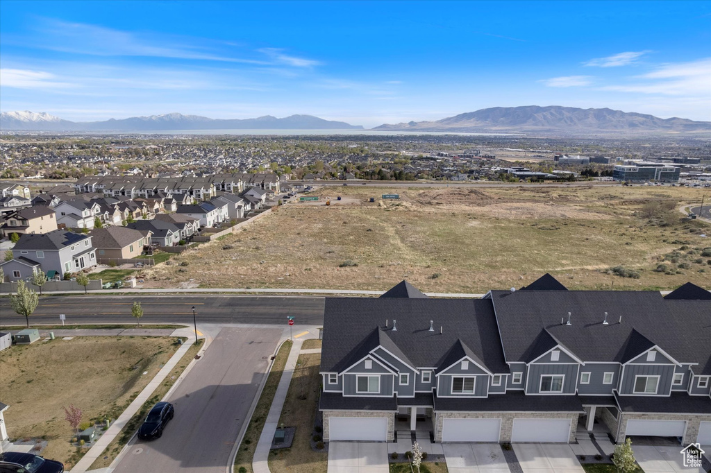 Birds eye view of property with a residential view and a mountain view
