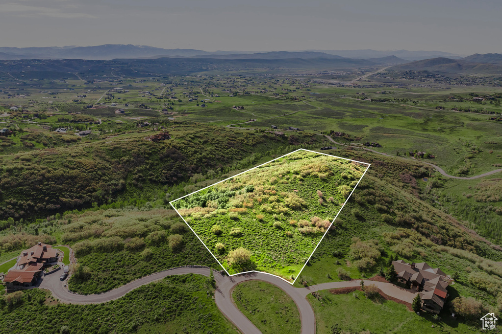 Aerial view of property's location featuring mountains and property parcel outlined