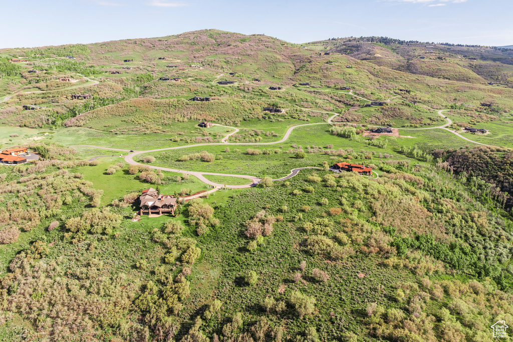 Aerial overview of property's location with mountains