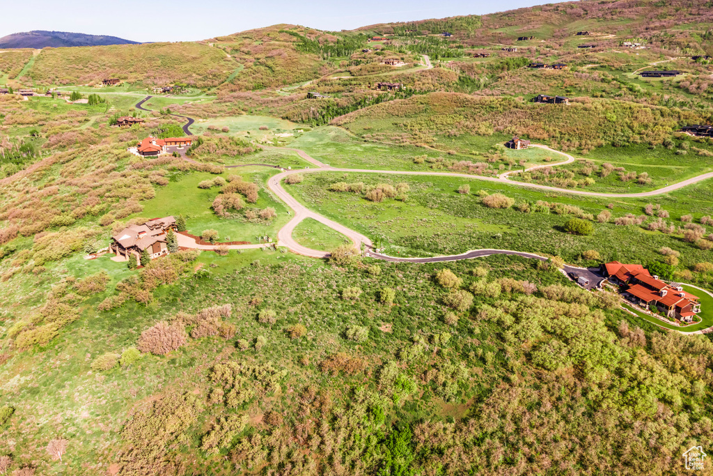 Aerial overview of property's location with a mountainous background