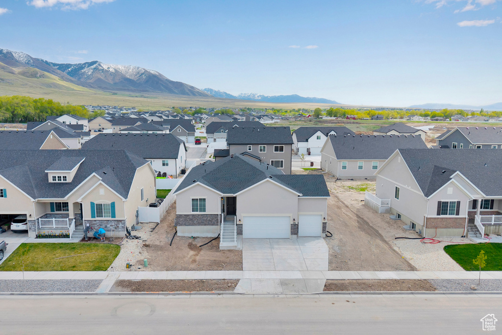 Aerial view of residential area featuring a mountain backdrop