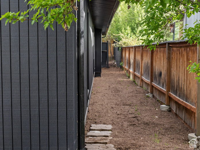 View of side of property featuring a fenced backyard