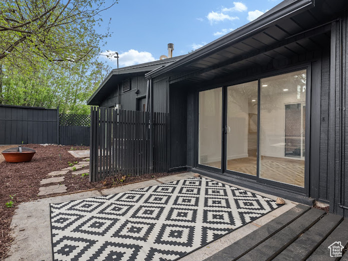 View of patio with fence