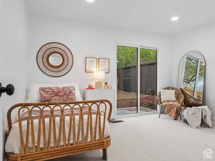 Carpeted bedroom featuring access to exterior and recessed lighting