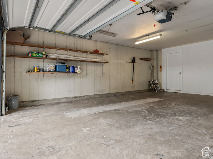 Garage featuring a garage door opener