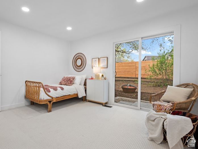 Carpeted bedroom featuring baseboards, access to outside, and recessed lighting
