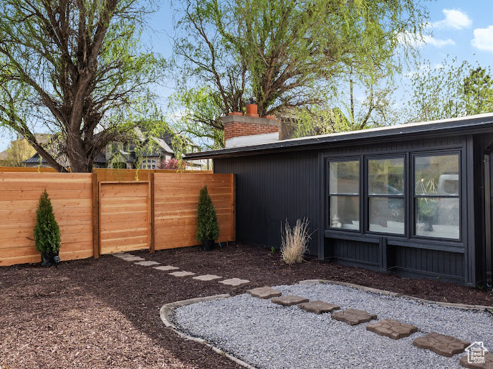 View of yard featuring fence
