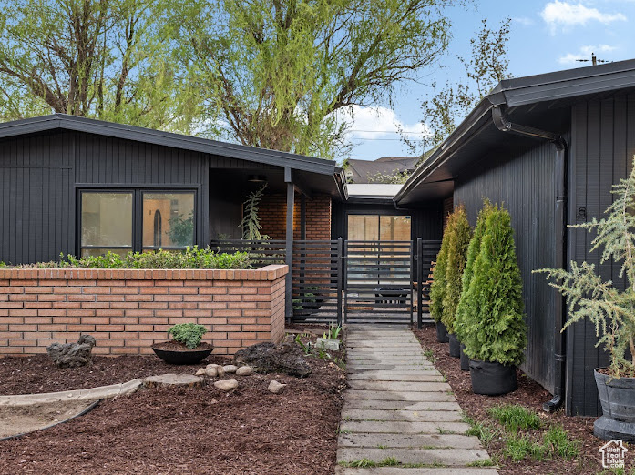 Property entrance with a gate and fence