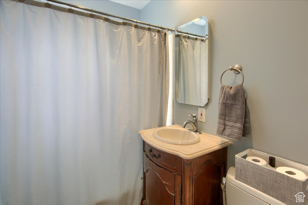 Bathroom with toilet and vanity
