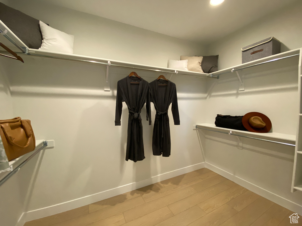 Walk in closet featuring light wood-type flooring