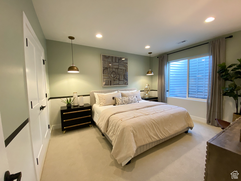Bedroom featuring recessed lighting, baseboards, visible vents, and light colored carpet