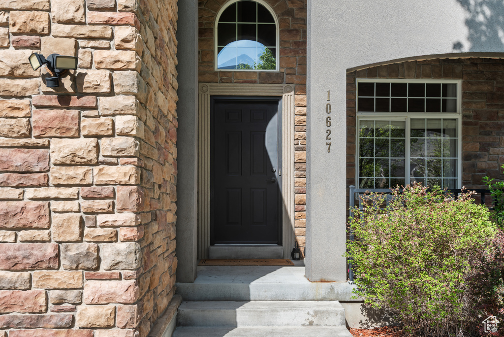 Property entrance featuring stone siding