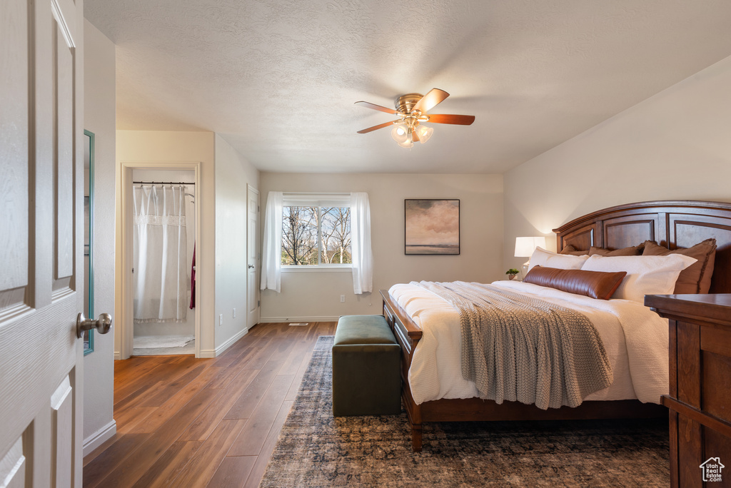 Bedroom featuring baseboards, a ceiling fan, and wood finished floors