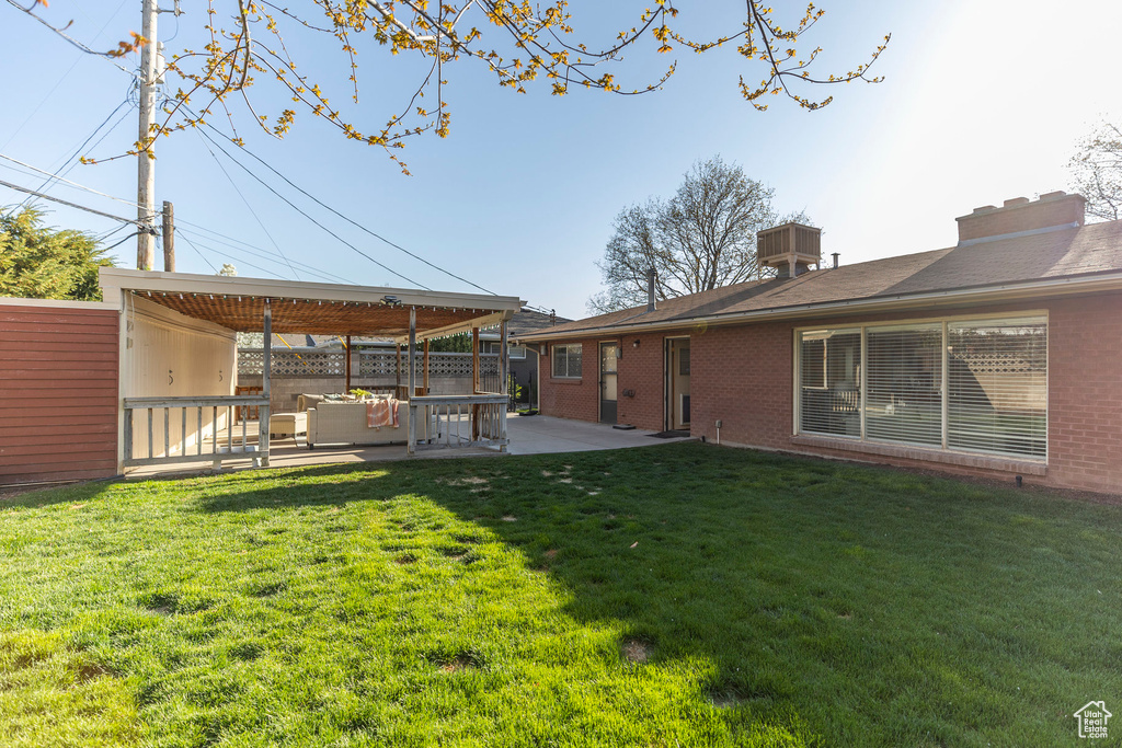 View of yard featuring a patio area and an outdoor living space