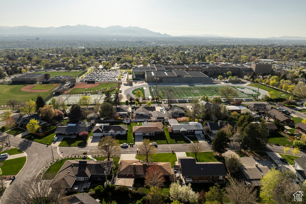 Aerial perspective of suburban area with a mountain backdrop