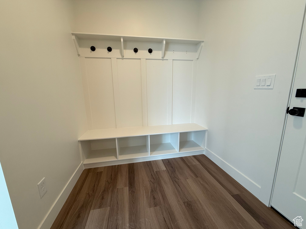 Mudroom with baseboards and dark wood finished floors
