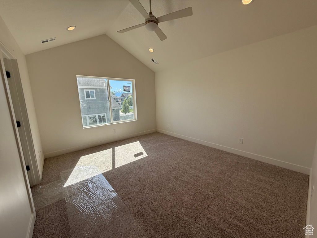 Unfurnished bedroom with carpet floors, lofted ceiling, recessed lighting, baseboards, and ceiling fan