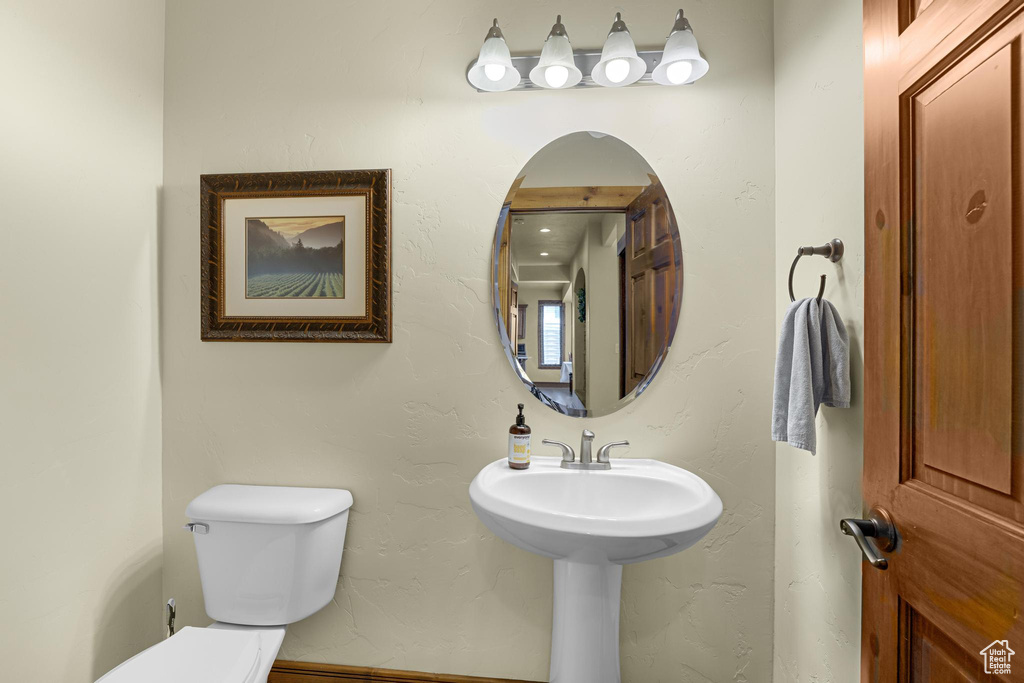 Half bath featuring toilet