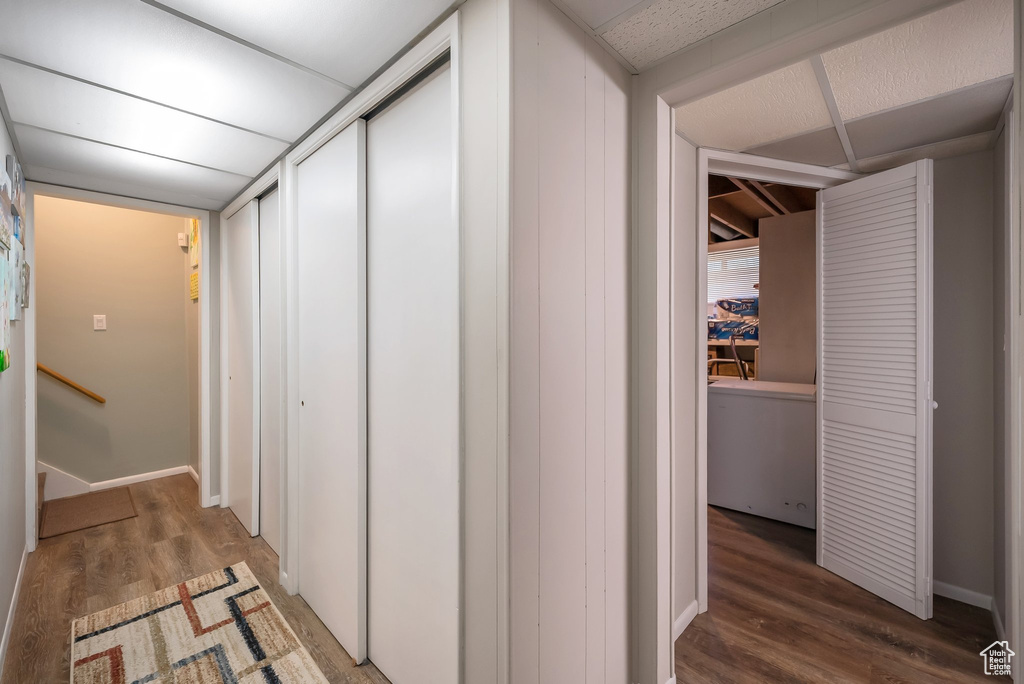 Hall featuring baseboards and wood finished floors