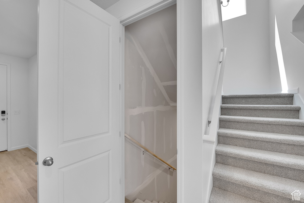 Stairway with wood finished floors