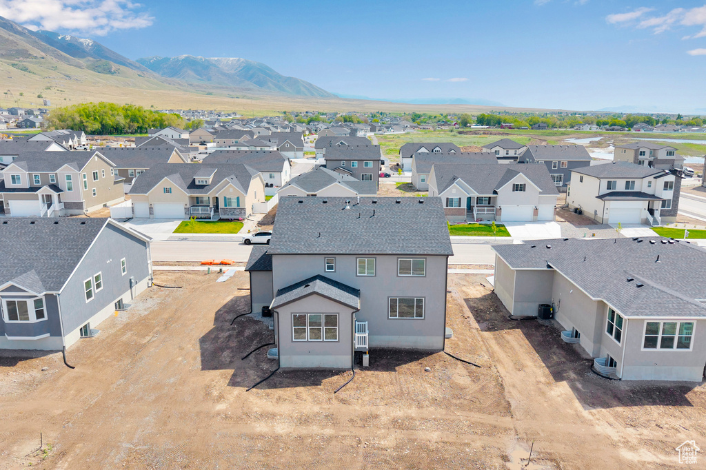 Aerial view of residential area with a mountain backdrop