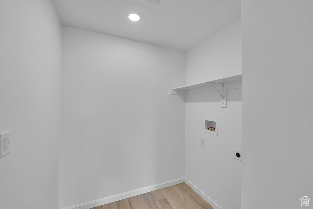 Laundry area with washer hookup, light wood-style floors, baseboards, electric dryer hookup, and recessed lighting
