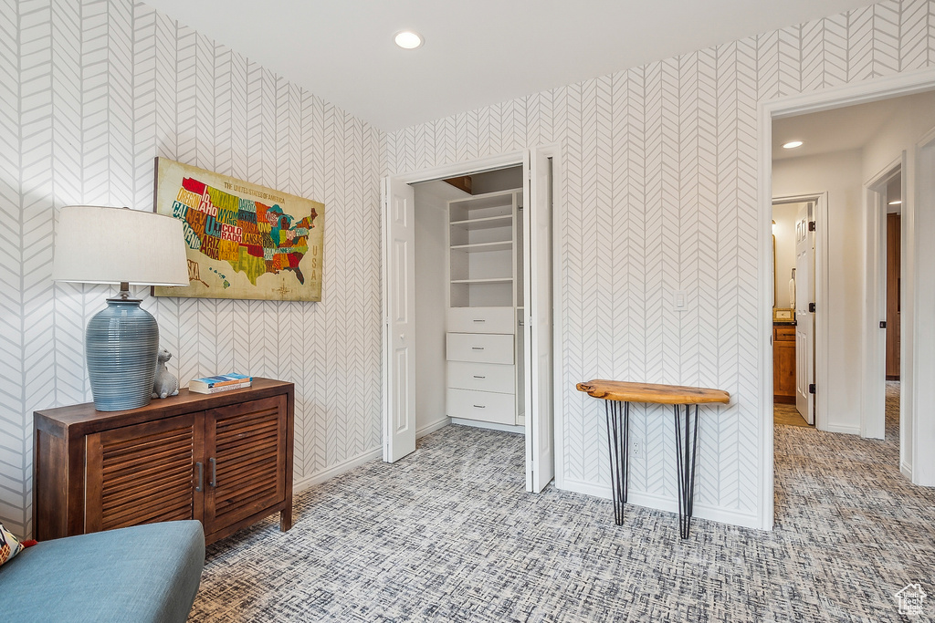 Bedroom featuring wallpapered walls, carpet floors, baseboards, and recessed lighting