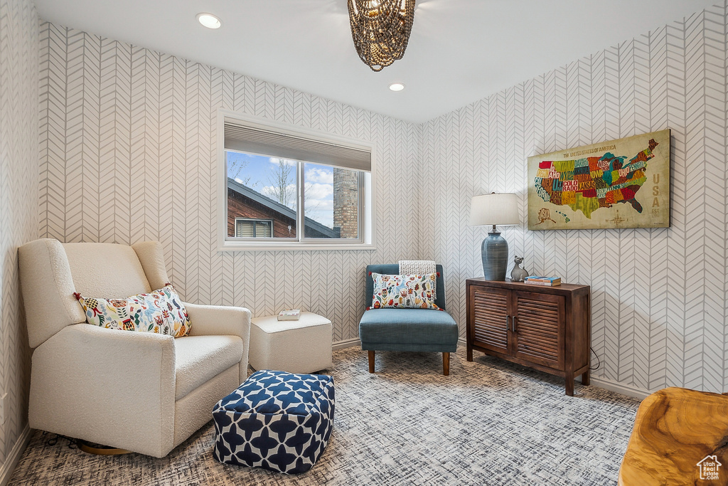 Living area with recessed lighting, wallpapered walls, and carpet