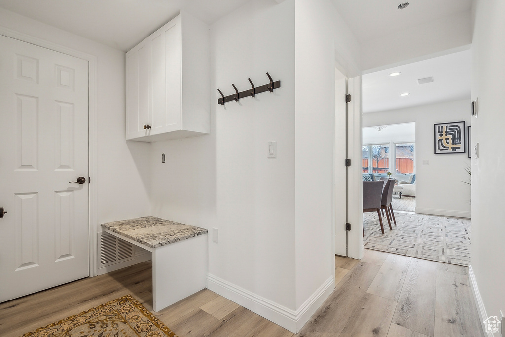 Mudroom with baseboards, recessed lighting, visible vents, and light wood-type flooring