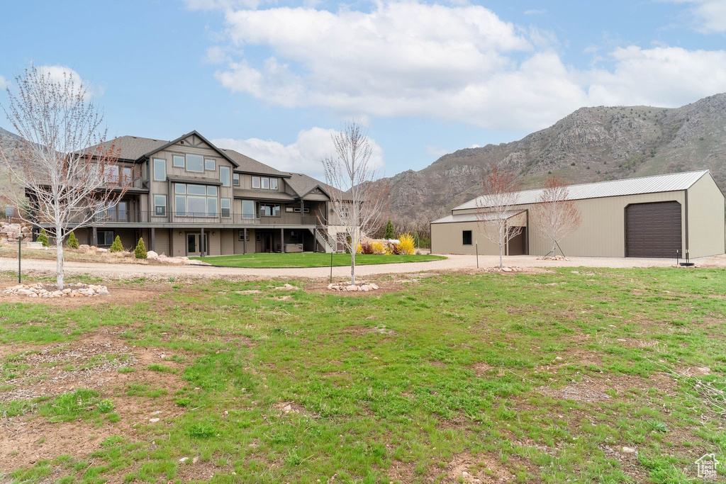 Exterior space featuring an outbuilding, a pole building, and a mountain view
