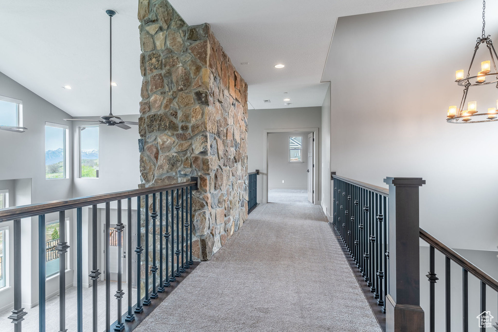 Corridor featuring baseboards, carpet, an upstairs landing, a chandelier, and recessed lighting