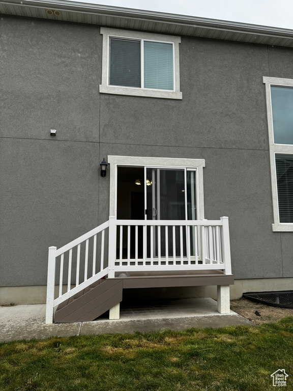 Exterior space featuring stucco siding